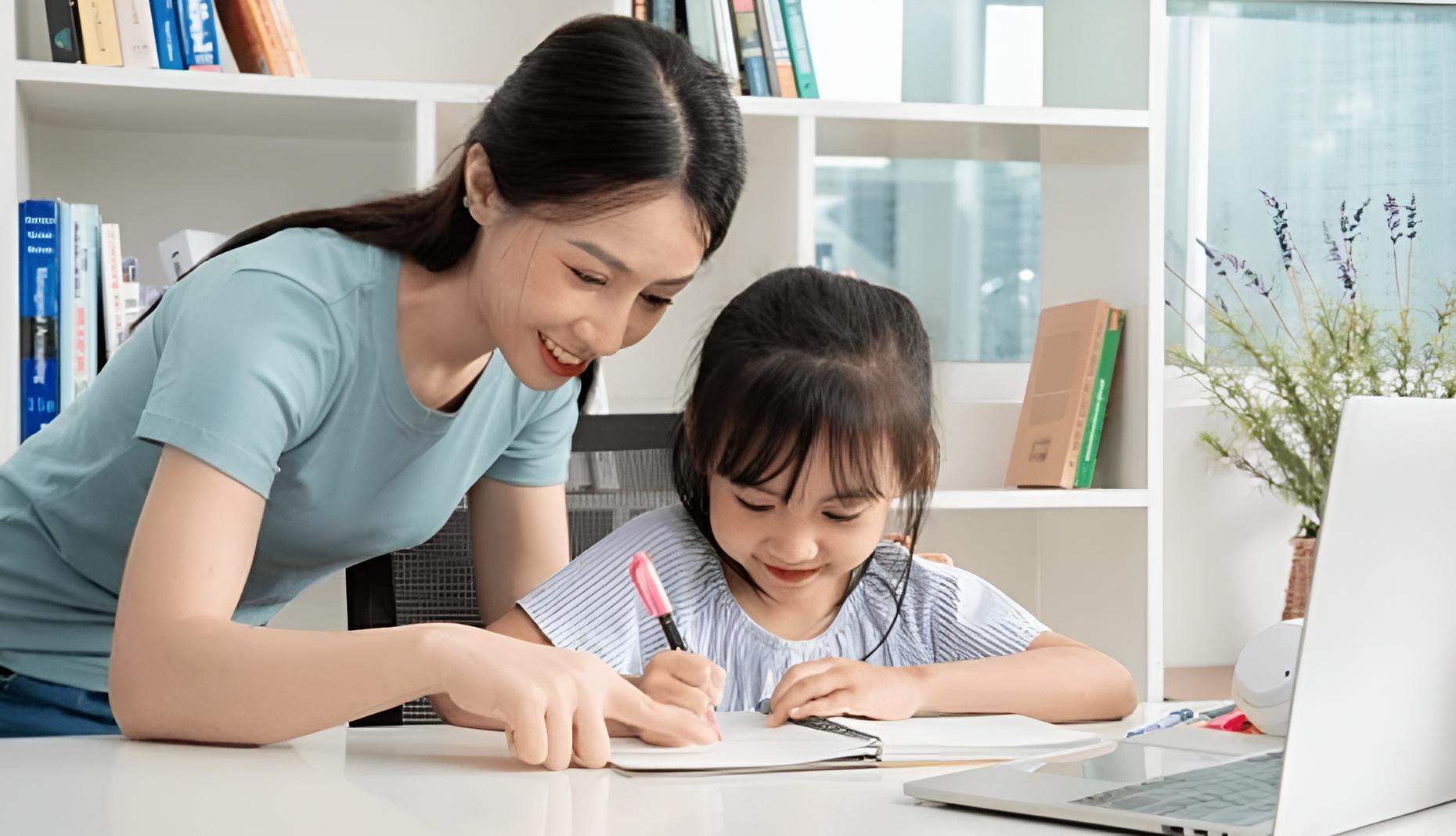 Tutor helping a child study at home